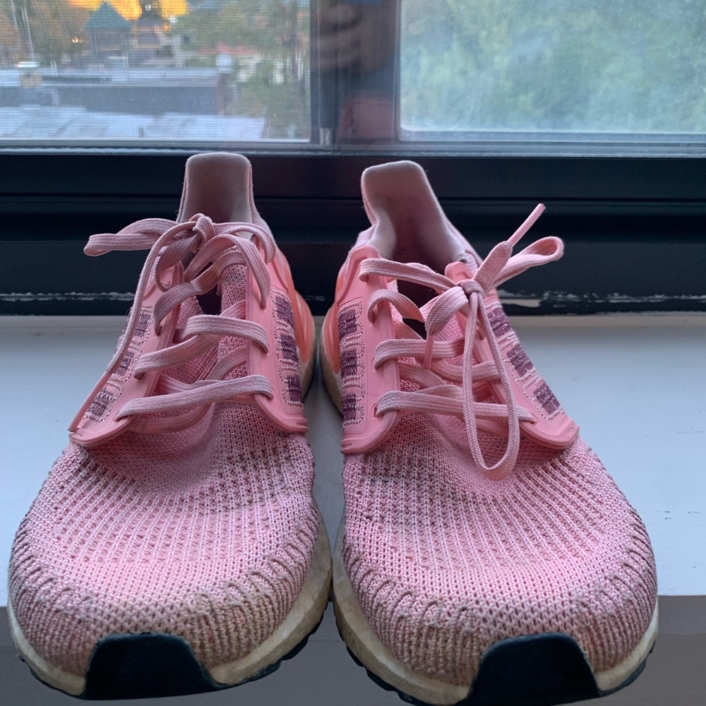 Well-worn Adidas running shoes